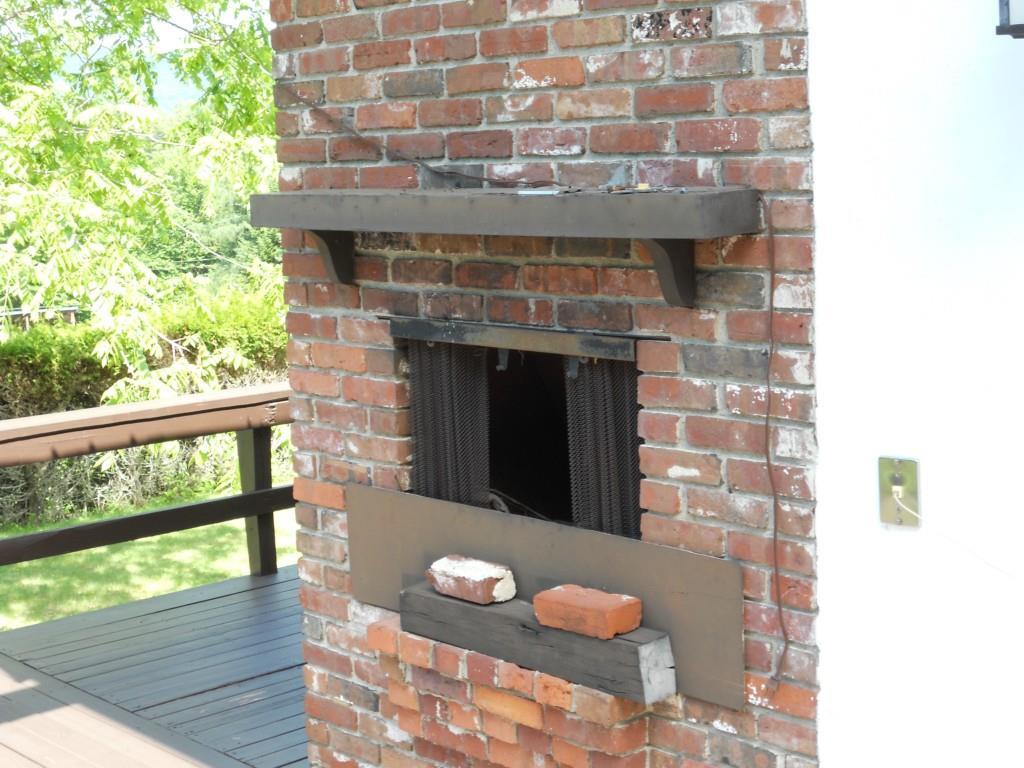 32 Sturtevant Pond Road Errol, NH 03579 - Photo 18 of 19 Deck fireplace for cooking or relaxing