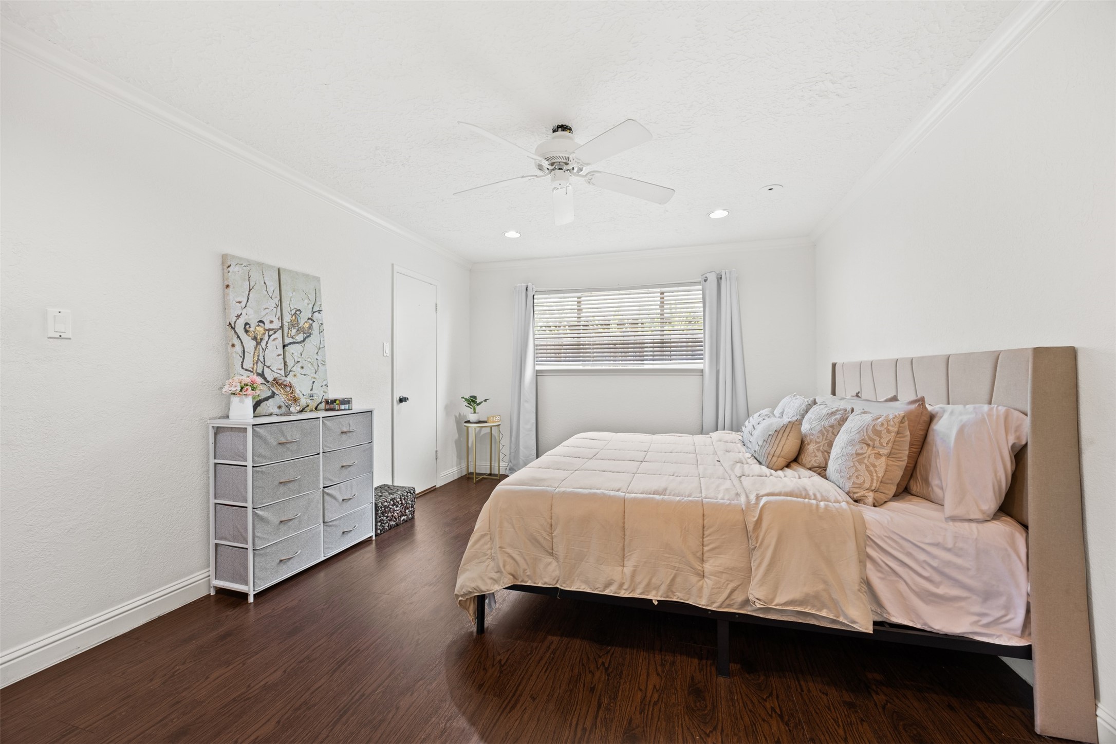 6830 Deer Ridge Lane Houston, TX 77086 - Photo 20 of 24 a bedroom with a bed and a dresser