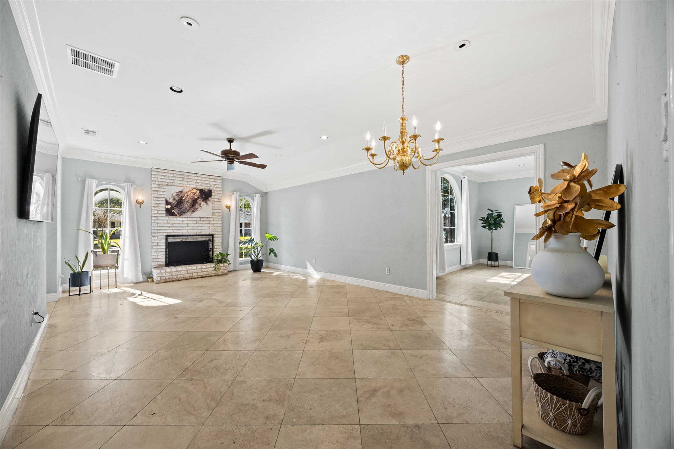 6830 Deer Ridge Lane Houston, TX 77086 - Photo 5 of 24 a view of a room with a chandelier and living room view