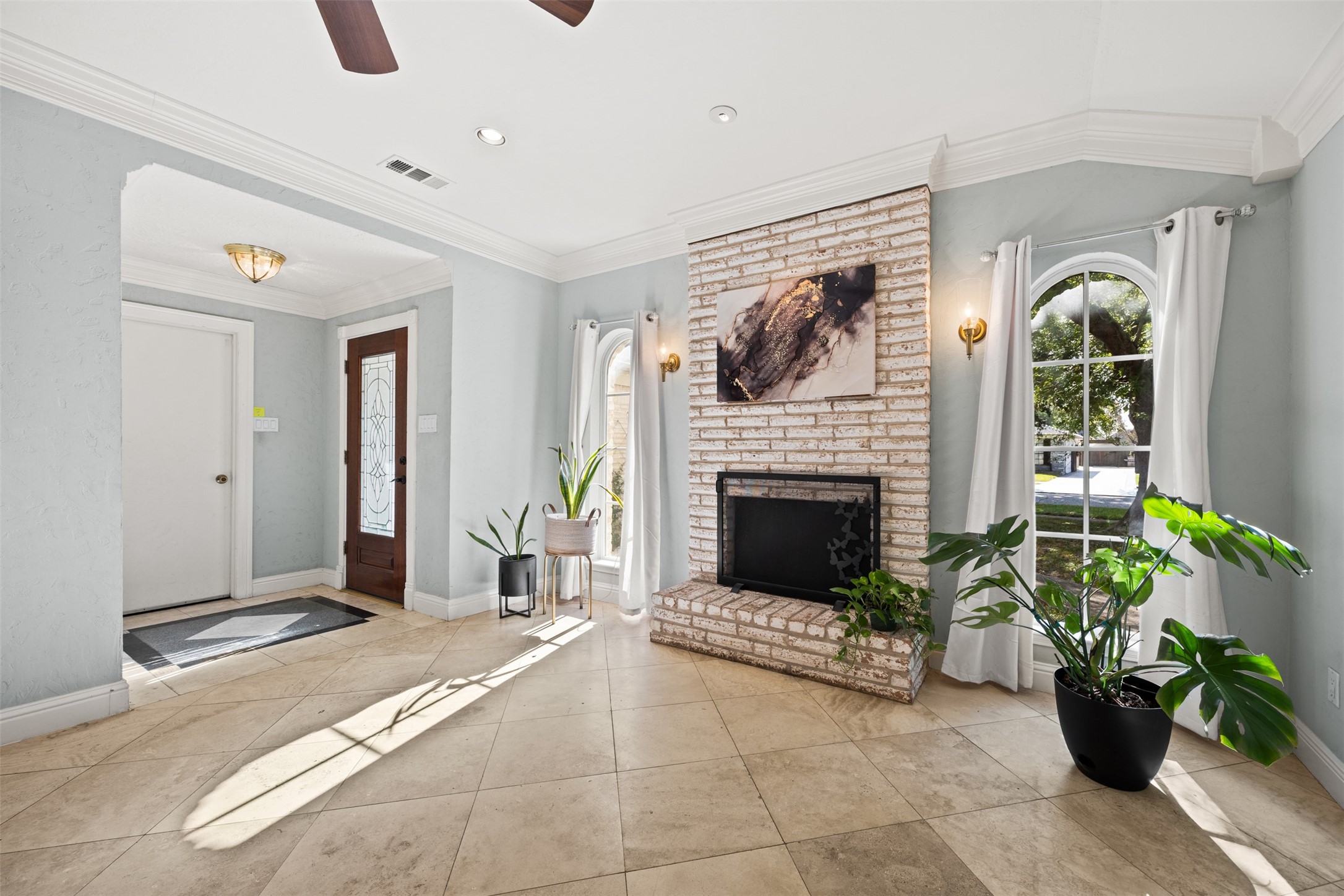 6830 Deer Ridge Lane Houston, TX 77086 - Photo 6 of 24 a living room with furniture and a fireplace