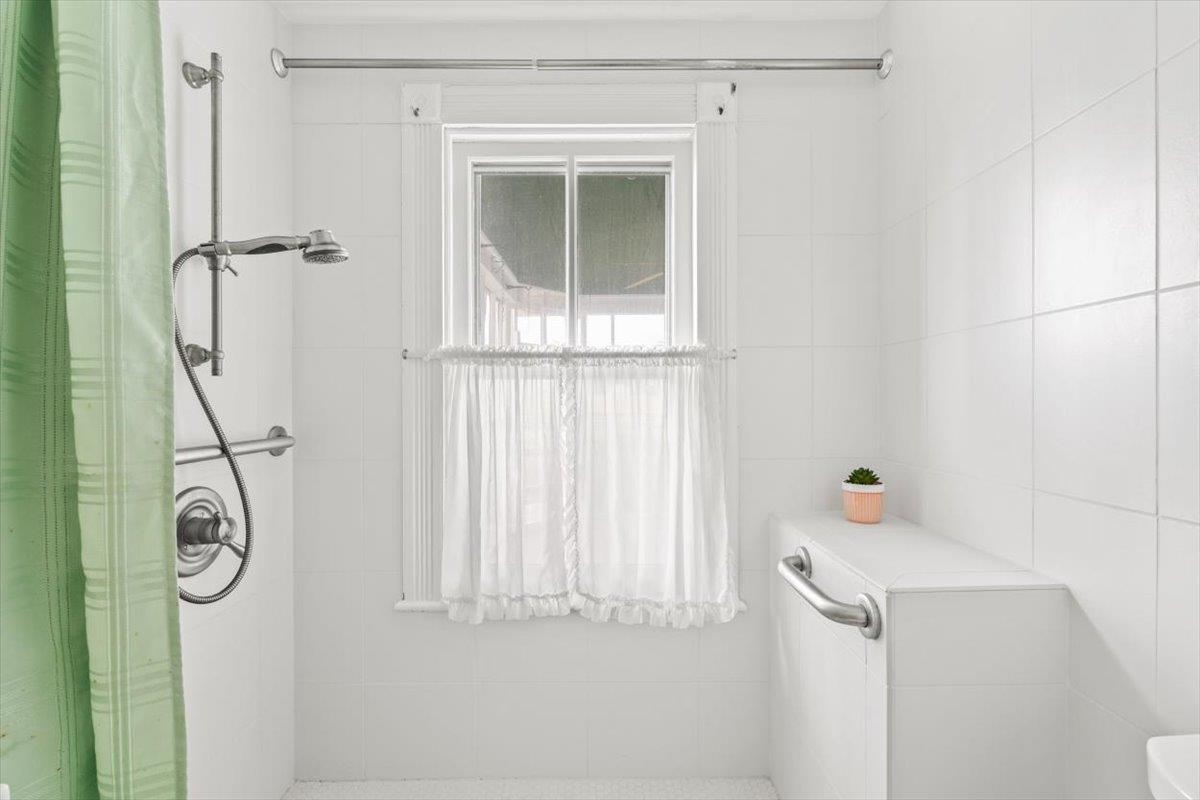 1188 Patterson Mill Road Grottoes, VA 24441 - Photo 16 of 58 a bathroom with a window and a shower