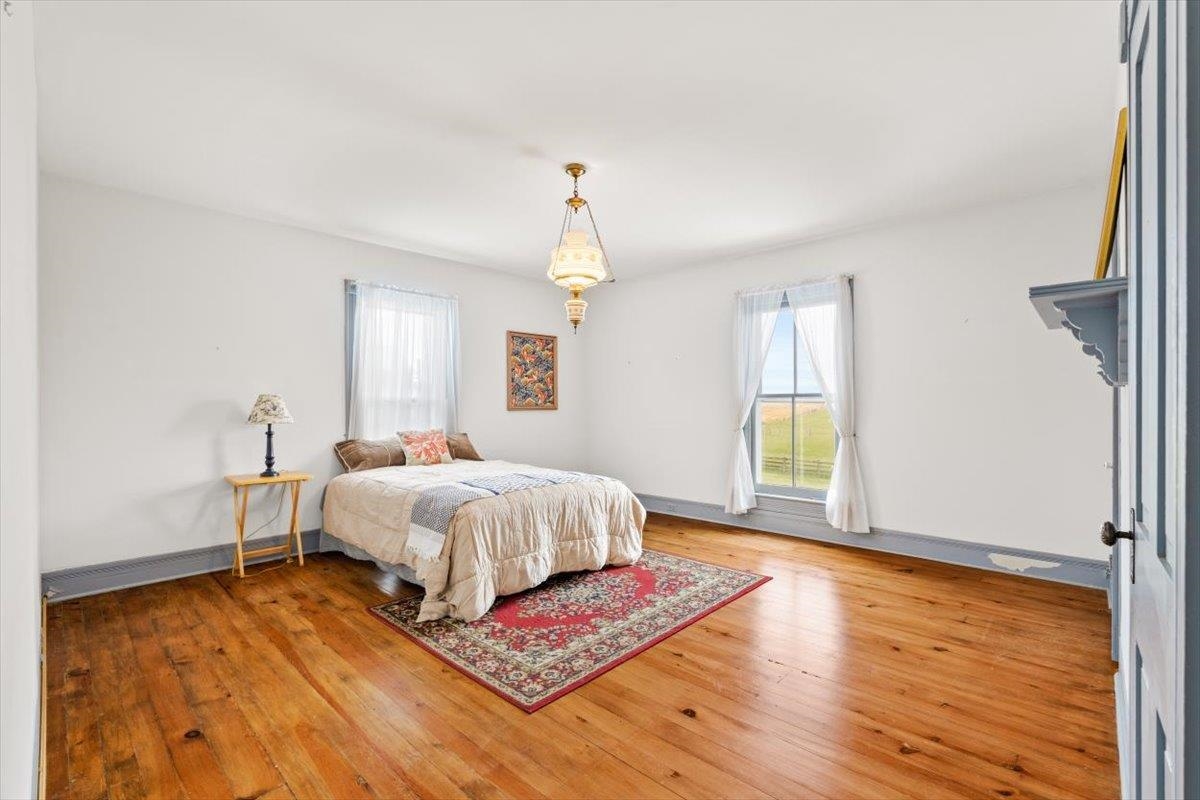 1188 Patterson Mill Road Grottoes, VA 24441 - Photo 28 of 58 a spacious bedroom with a bed and a window