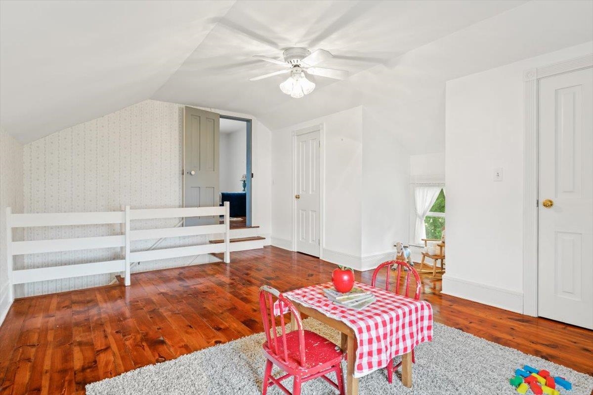 1188 Patterson Mill Road Grottoes, VA 24441 - Photo 36 of 58 a bedroom with a bed and wooden floor
