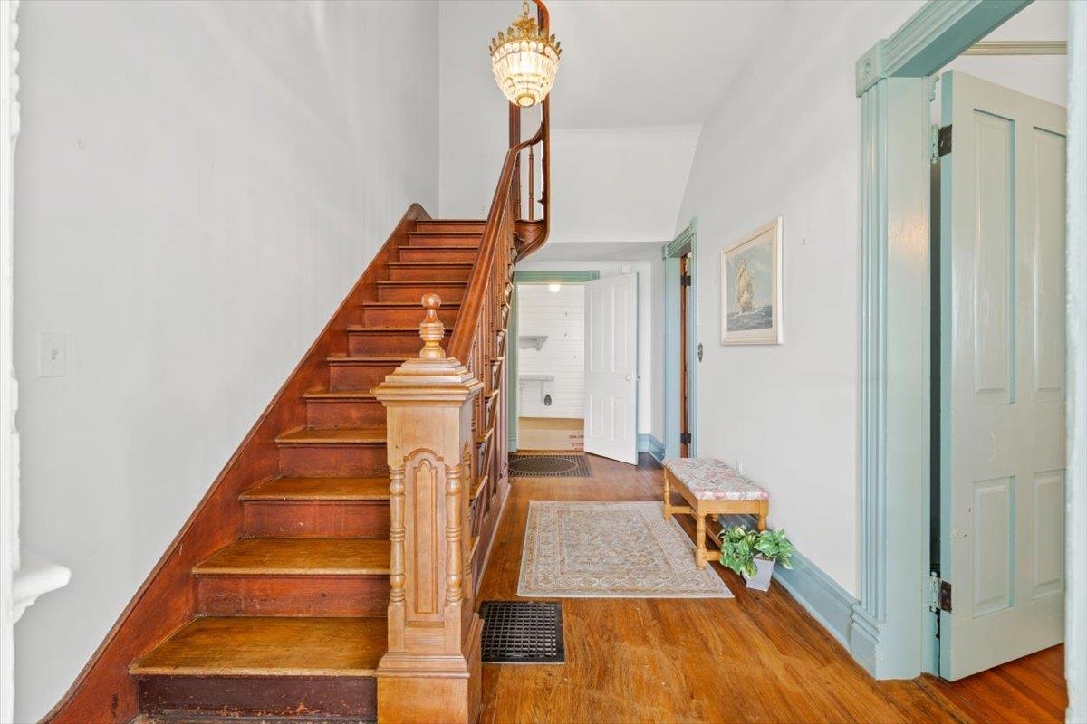 1188 Patterson Mill Road Grottoes, VA 24441 - Photo 8 of 58 a view of staircase with wooden floor and white walls