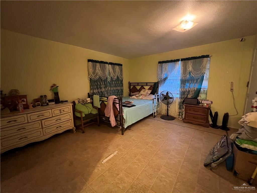 409 South 24th Street Donna, TX 78537 - Photo 11 of 11 a bed room with furniture and a window