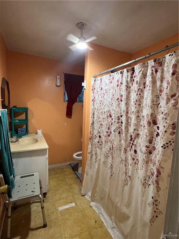 409 South 24th Street Donna, TX 78537 - Photo 8 of 11 a bathroom with a sink toilet and shower