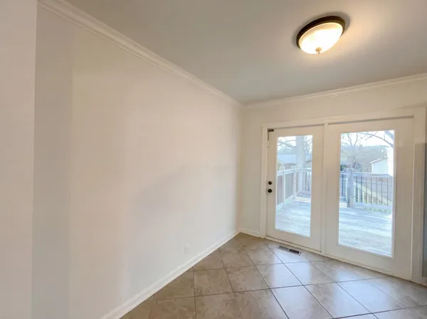 an empty room with front door