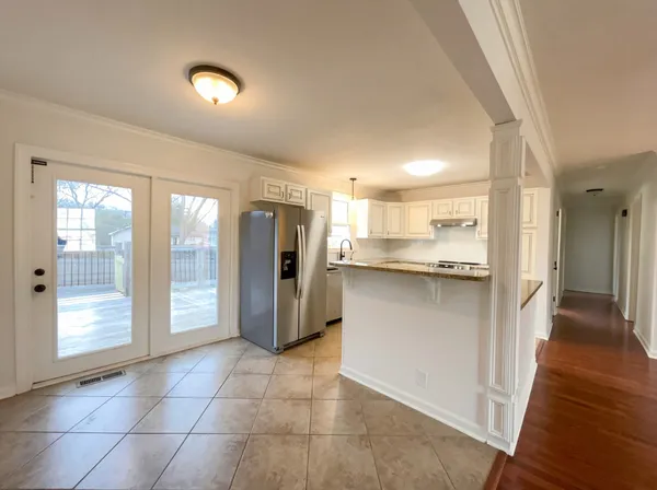 a view of a kitchen with a sink and a window