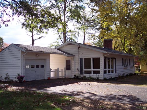 25 Lindsay Road Springfield, MA 01128 - Photo 1 of 30 a front view of a house with a yard and garage