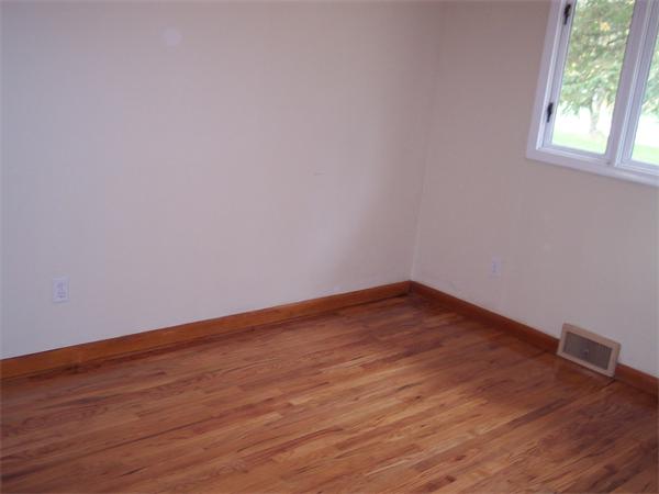 25 Lindsay Road Springfield, MA 01128 - Photo 14 of 30 a view of empty room with wooden floor and fan
