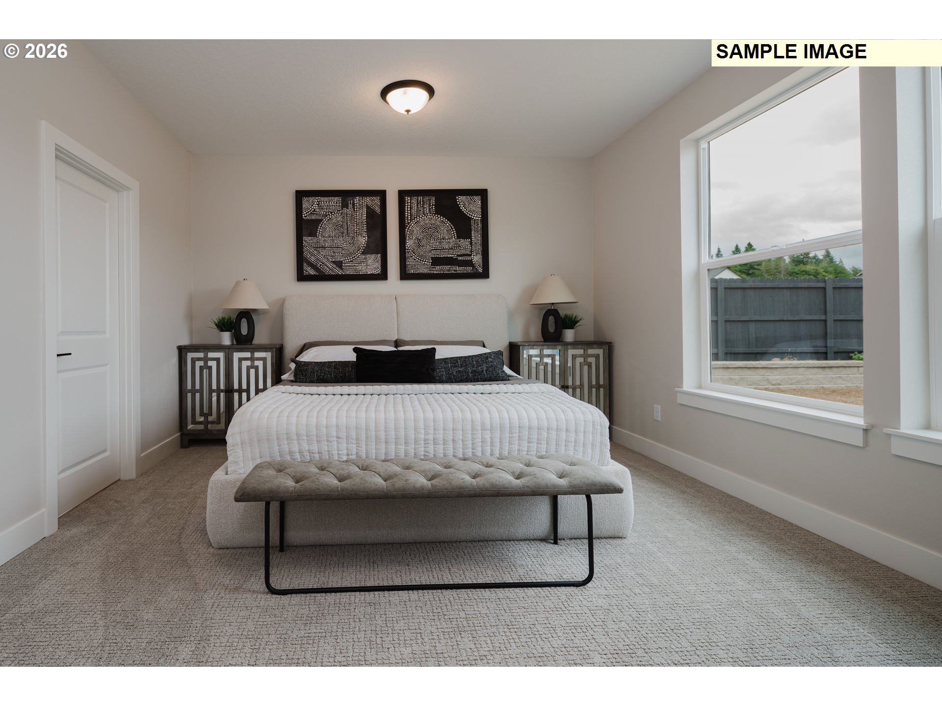 1403 North 41st Place Ridgefield, WA 98642 - Photo 18 of 30 a bedroom with a bed a table and painting