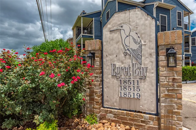 a house that has a tree in front of it