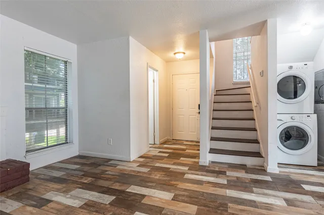 an aerial view of a house with a swimming pool yard and outdoor seating