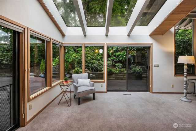 a view of a chair and table on the wooden floor
