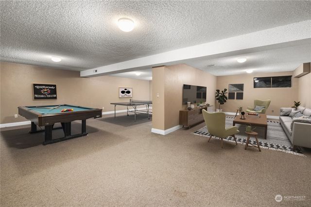 a utility room with sink dryer and washer