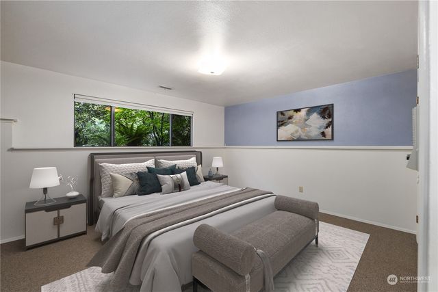 a bedroom with bed and a window