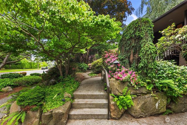 a front view of a house having fountain
