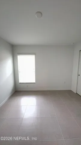 a view of a room that has a window in it