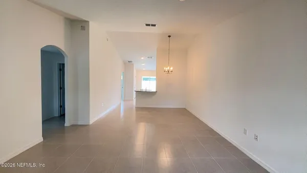 a view of an empty room with a bathroom