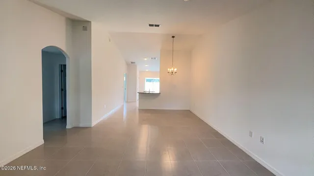 a view of an empty room with a bathroom