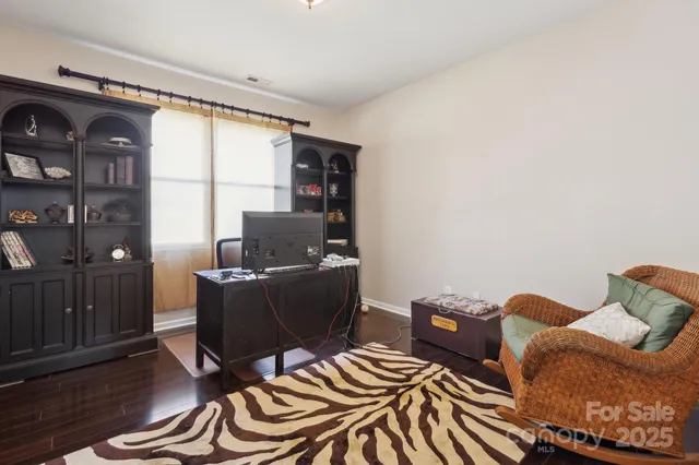 a workspace with furniture and window