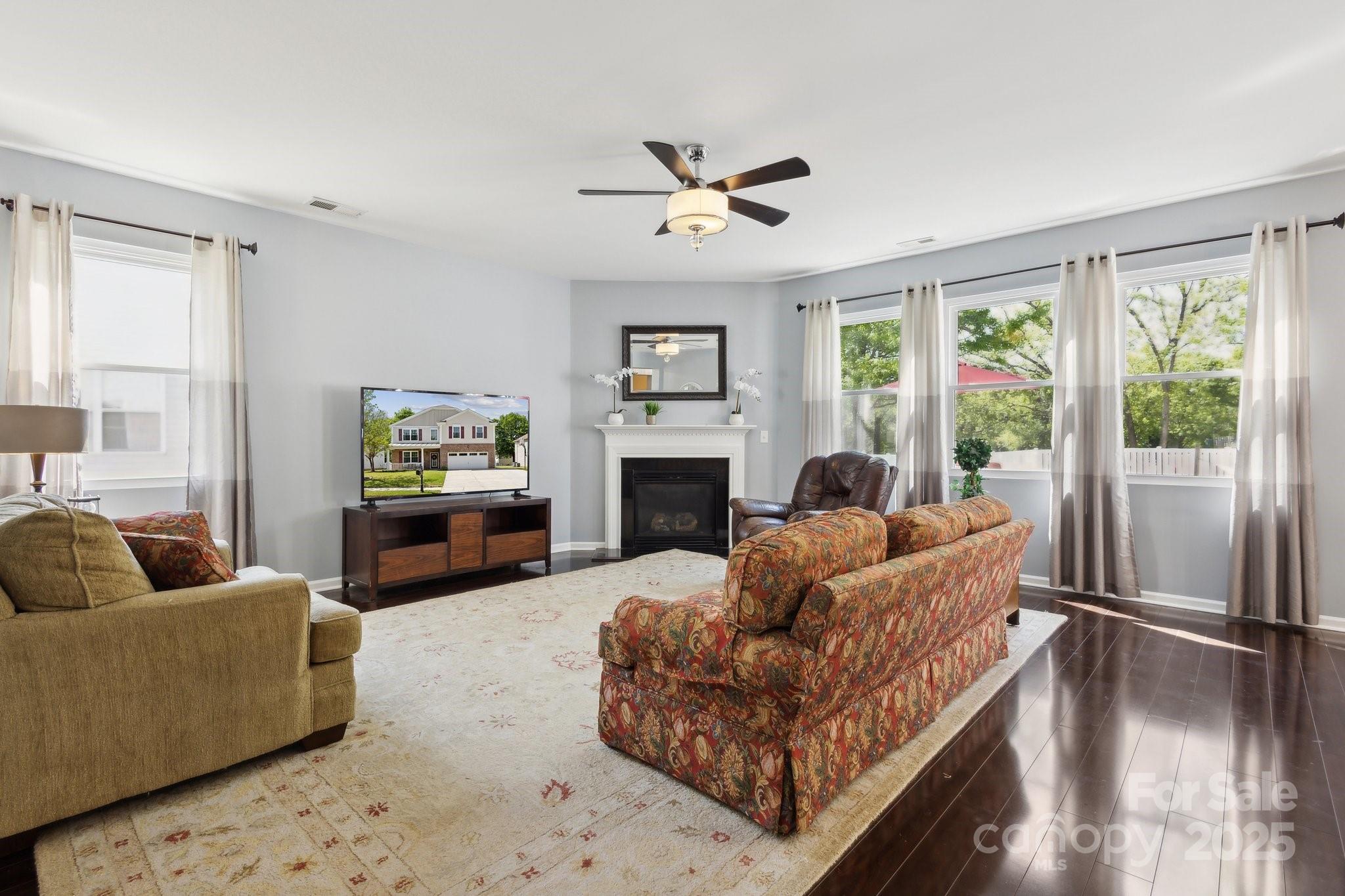 221 Sycamore Creek Road Fort Mill, SC 29708 - Photo 14 of 37 a living room with furniture a window and a fireplace
