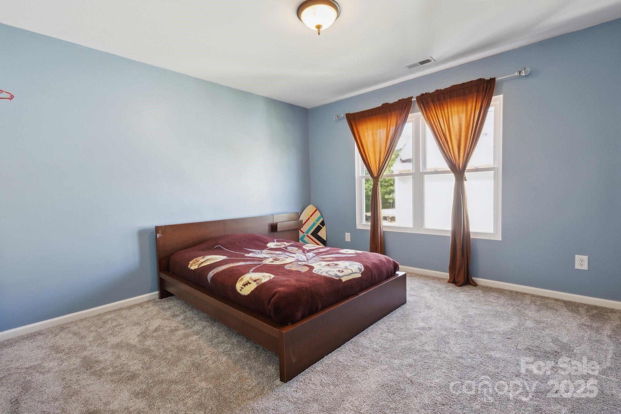 221 Sycamore Creek Road Fort Mill, SC 29708 - Photo 25 of 37 a bed sitting in a bedroom next to a window