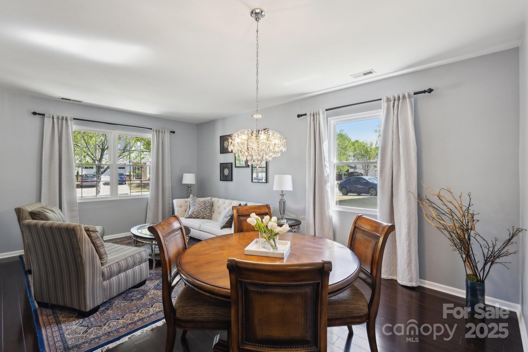 221 Sycamore Creek Road Fort Mill, SC 29708 - Photo 7 of 37 a dining room with furniture a chandelier and window