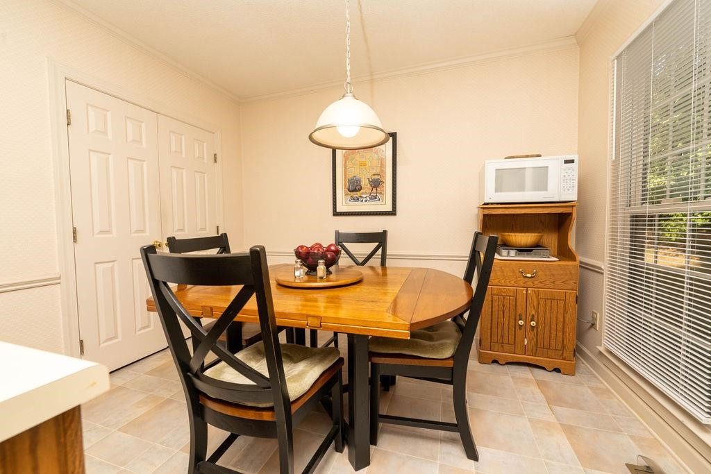 119 Nuttree Way Durham, NC 27713 - Photo 16 of 41 a dining room with furniture and wooden floor