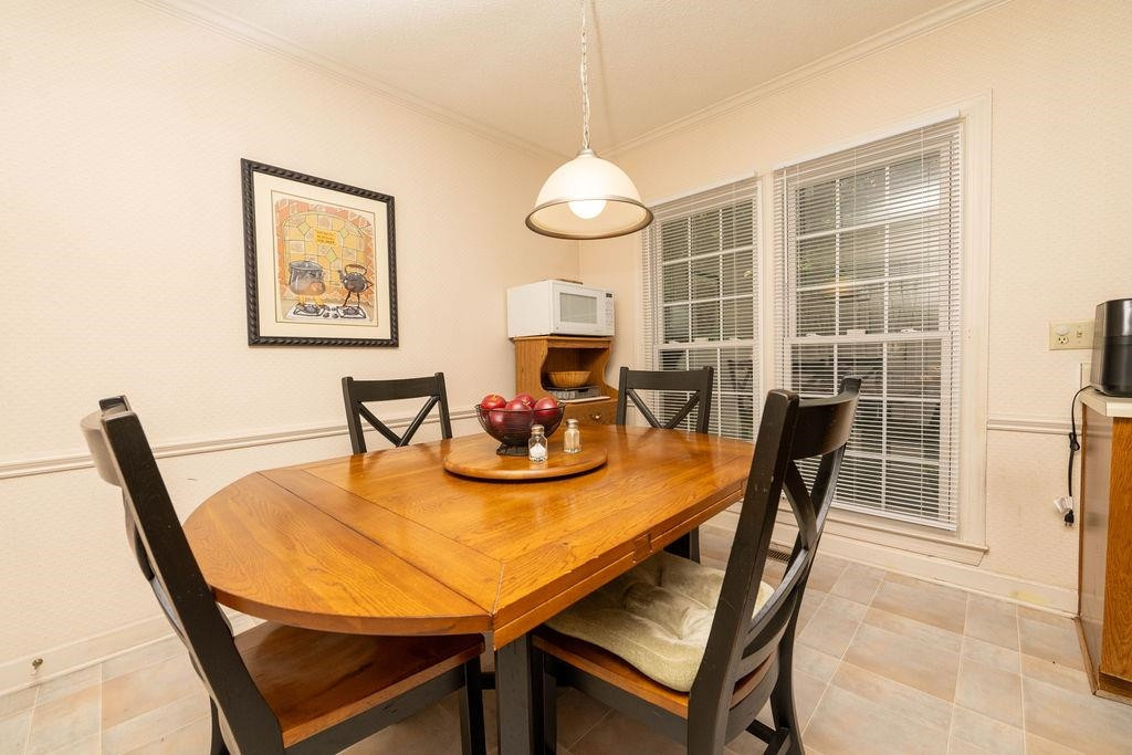 119 Nuttree Way Durham, NC 27713 - Photo 17 of 41 a view of a dining room with furniture and a chandelier