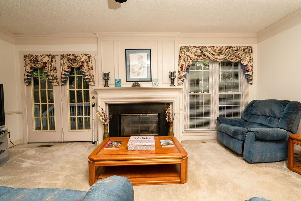 119 Nuttree Way Durham, NC 27713 - Photo 18 of 41 a living room with furniture and a fireplace