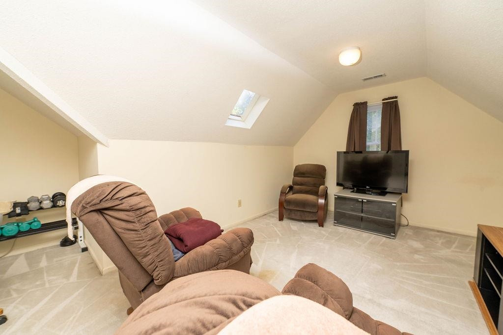 119 Nuttree Way Durham, NC 27713 - Photo 30 of 41 a living room with furniture and a flat screen tv