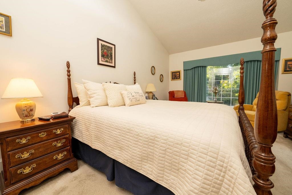 119 Nuttree Way Durham, NC 27713 - Photo 33 of 41 a bedroom with a bed and a night stand