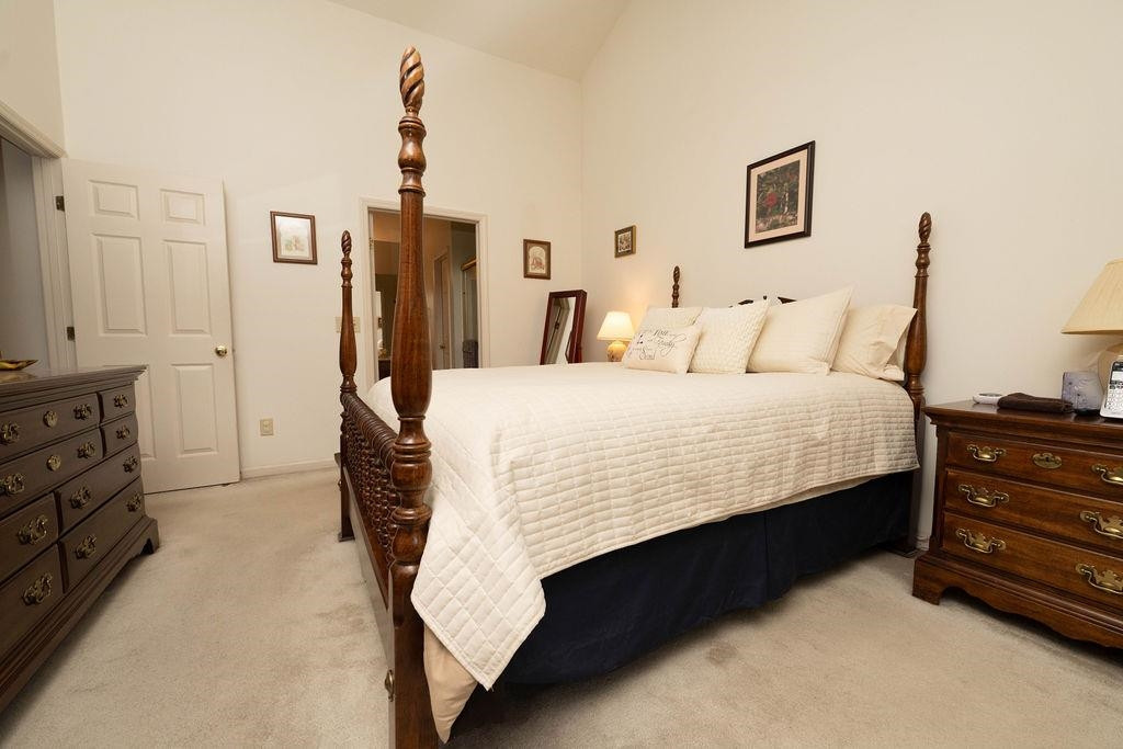 119 Nuttree Way Durham, NC 27713 - Photo 35 of 41 a large bed sitting in a bedroom and dresser