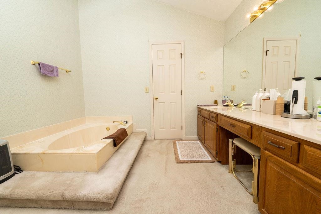 119 Nuttree Way Durham, NC 27713 - Photo 36 of 41 a spacious bathroom with a tub sink and mirror