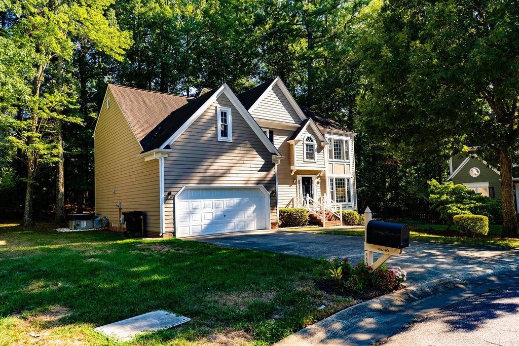 119 Nuttree Way Durham, NC 27713 - Photo 5 of 41 a front view of a house with a yard