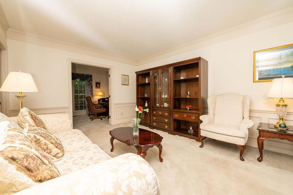 119 Nuttree Way Durham, NC 27713 - Photo 7 of 41 a bedroom with furniture and a lamp