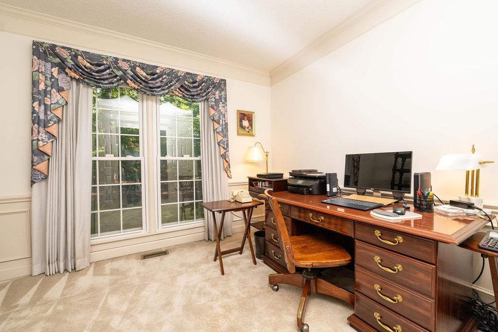 119 Nuttree Way Durham, NC 27713 - Photo 8 of 41 a view of a workspace with furniture and a window