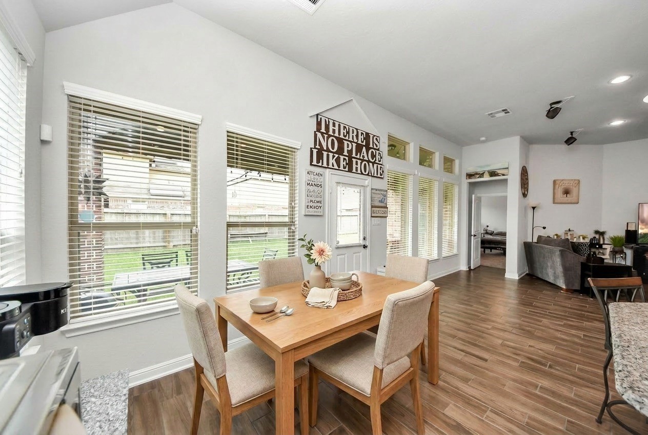 24503 Eucalyptus Way Spring, TX 77373 - Photo 19 of 27 a view of a dining room with furniture window and wooden floor
