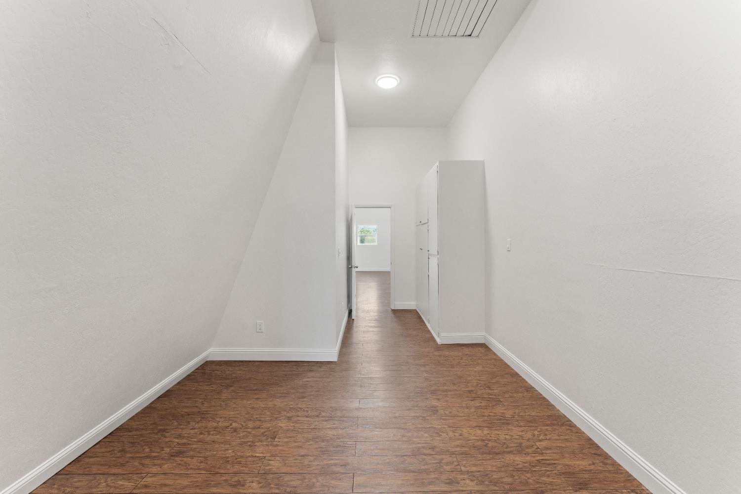 5585 Garden Bar Road, Unit 2 Lincoln, CA 95648 - Photo 18 of 65 a view of a hallway with wooden floor