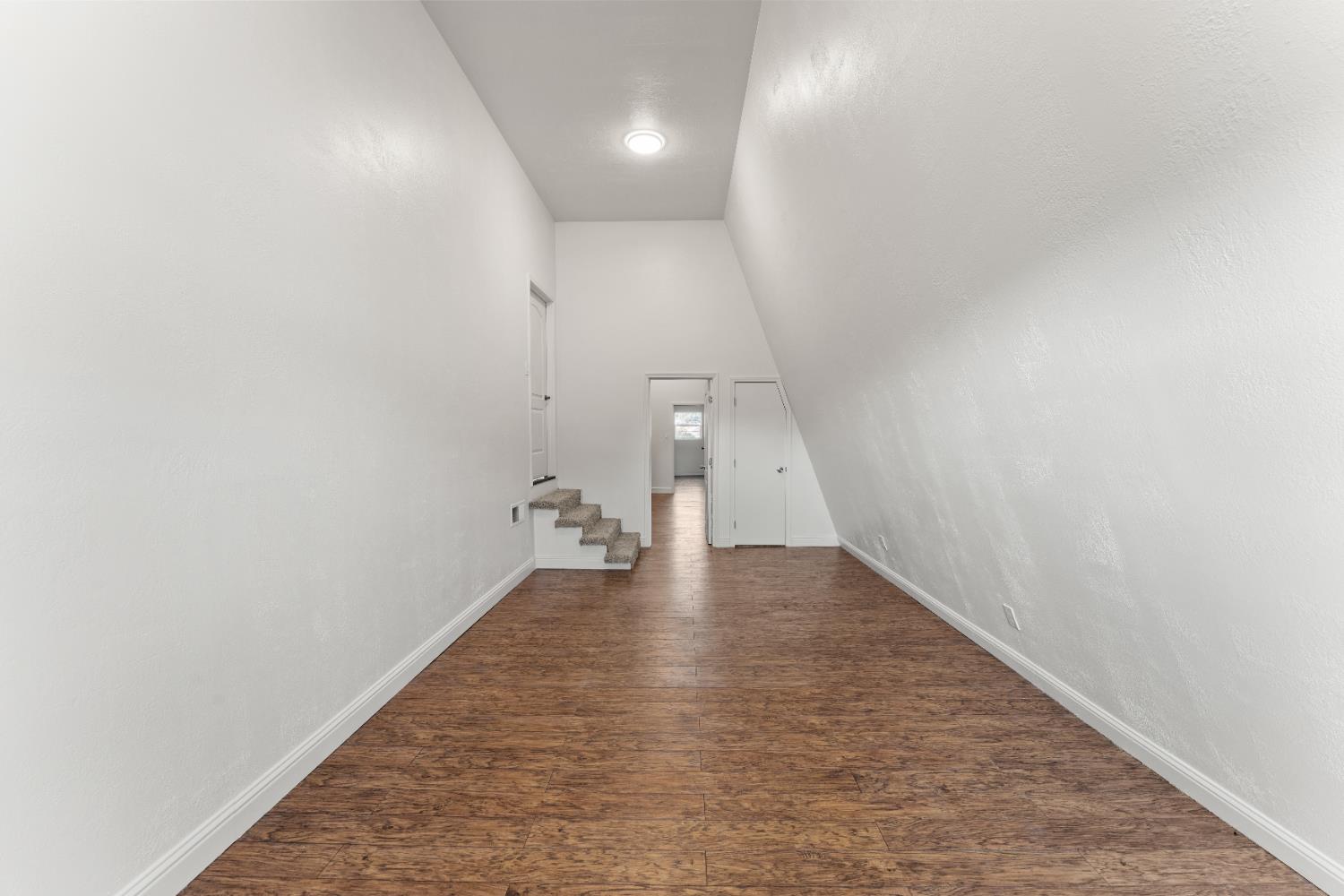 5585 Garden Bar Road, Unit 2 Lincoln, CA 95648 - Photo 20 of 65 a view of an empty room with wooden floor