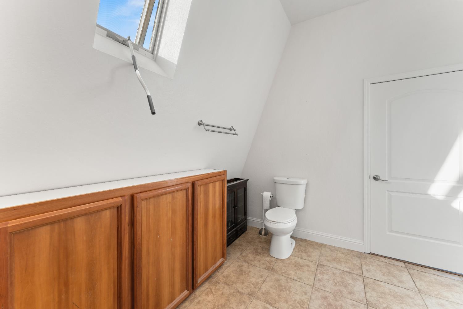 5585 Garden Bar Road, Unit 2 Lincoln, CA 95648 - Photo 22 of 65 a bathroom with a toilet and a shower