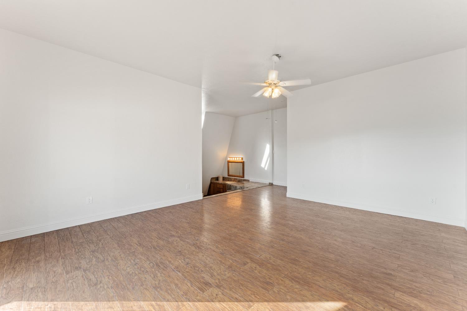 5585 Garden Bar Road, Unit 2 Lincoln, CA 95648 - Photo 25 of 65 a view of a room with a chandelier fan and wooden floor