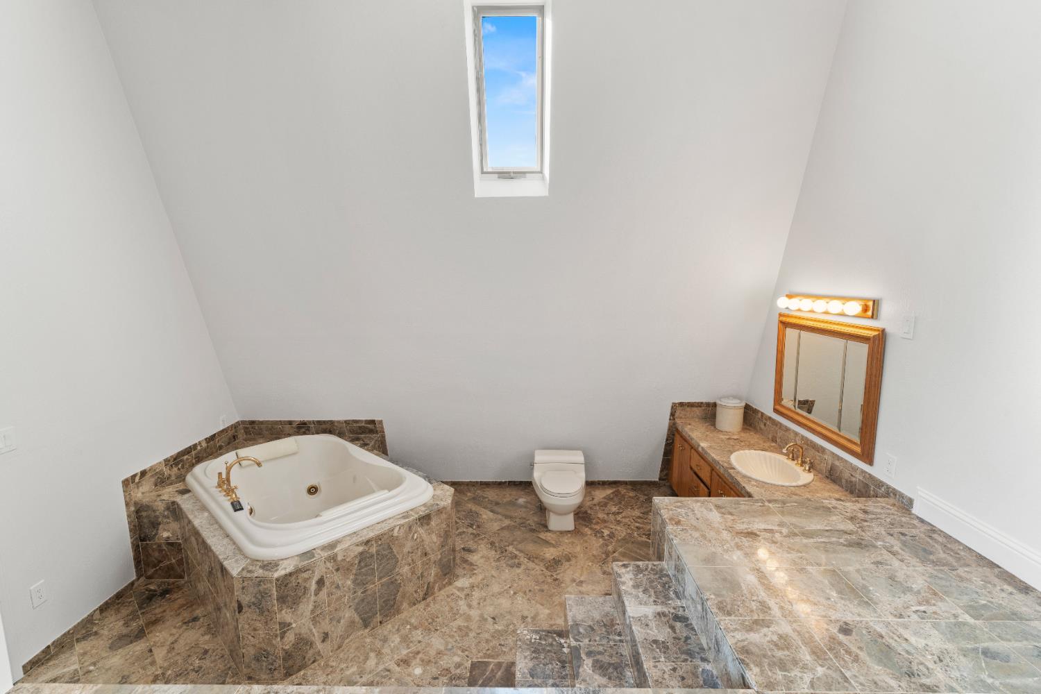 5585 Garden Bar Road, Unit 2 Lincoln, CA 95648 - Photo 26 of 65 a bathroom with a sink a toilet and mirror