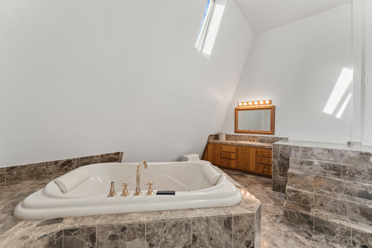 5585 Garden Bar Road, Unit 2 Lincoln, CA 95648 - Photo 27 of 65 a bathroom with a bathtub and a window