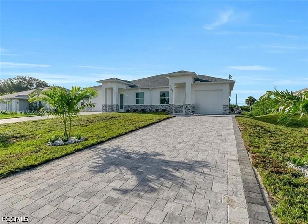 222 Pullman Street Lehigh Acres, FL 33974 - Photo 6 of 9 a front view of a house with a yard and garage