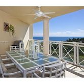 a view of a patio with table and chairs