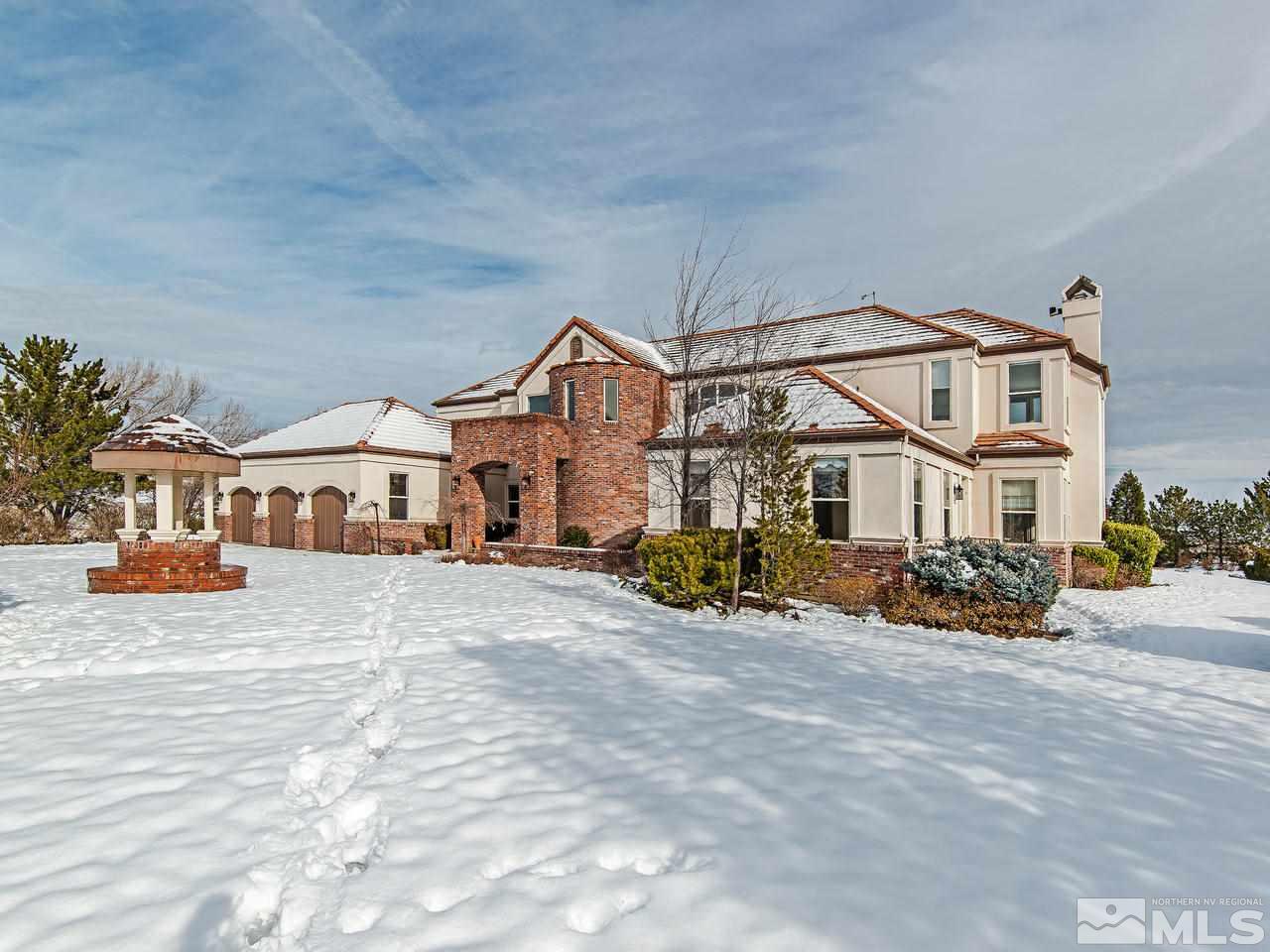 4195 Basque Lane Reno, NV 89519 - Photo 1 of 24 a view of a house with a yard and many windows