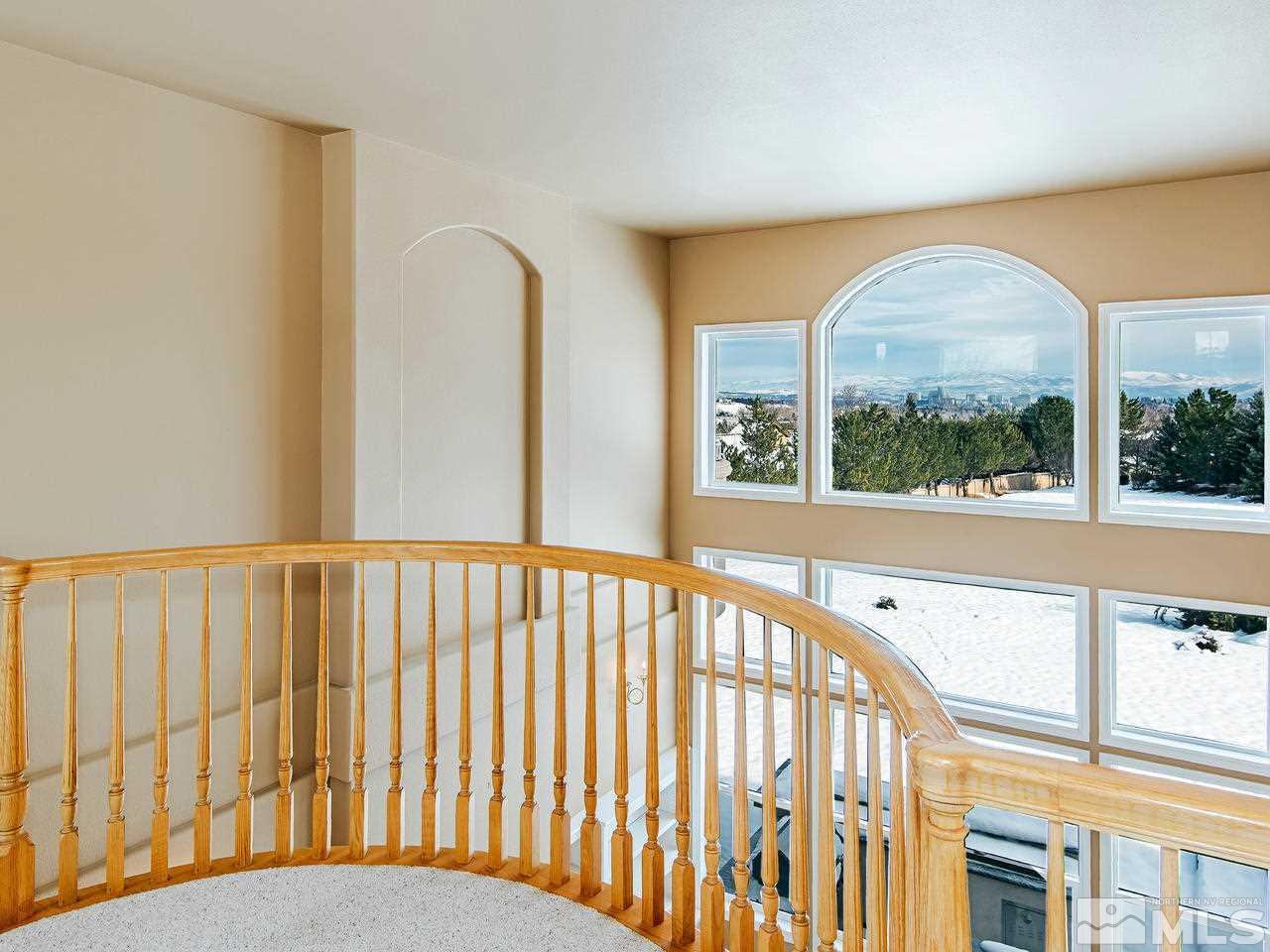 4195 Basque Lane Reno, NV 89519 - Photo 12 of 24 a view of a porch with a floor to ceiling window