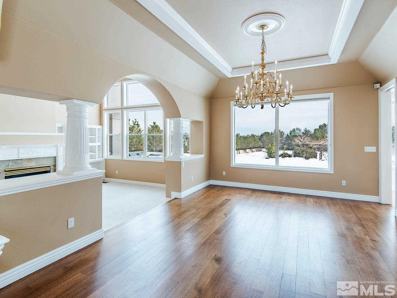 4195 Basque Lane Reno, NV 89519 - Photo 8 of 24 a view of an empty room with wooden floor and a window